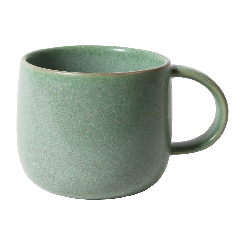 
                  
                    Photograph of a light green round ceramic mug
                  
                
