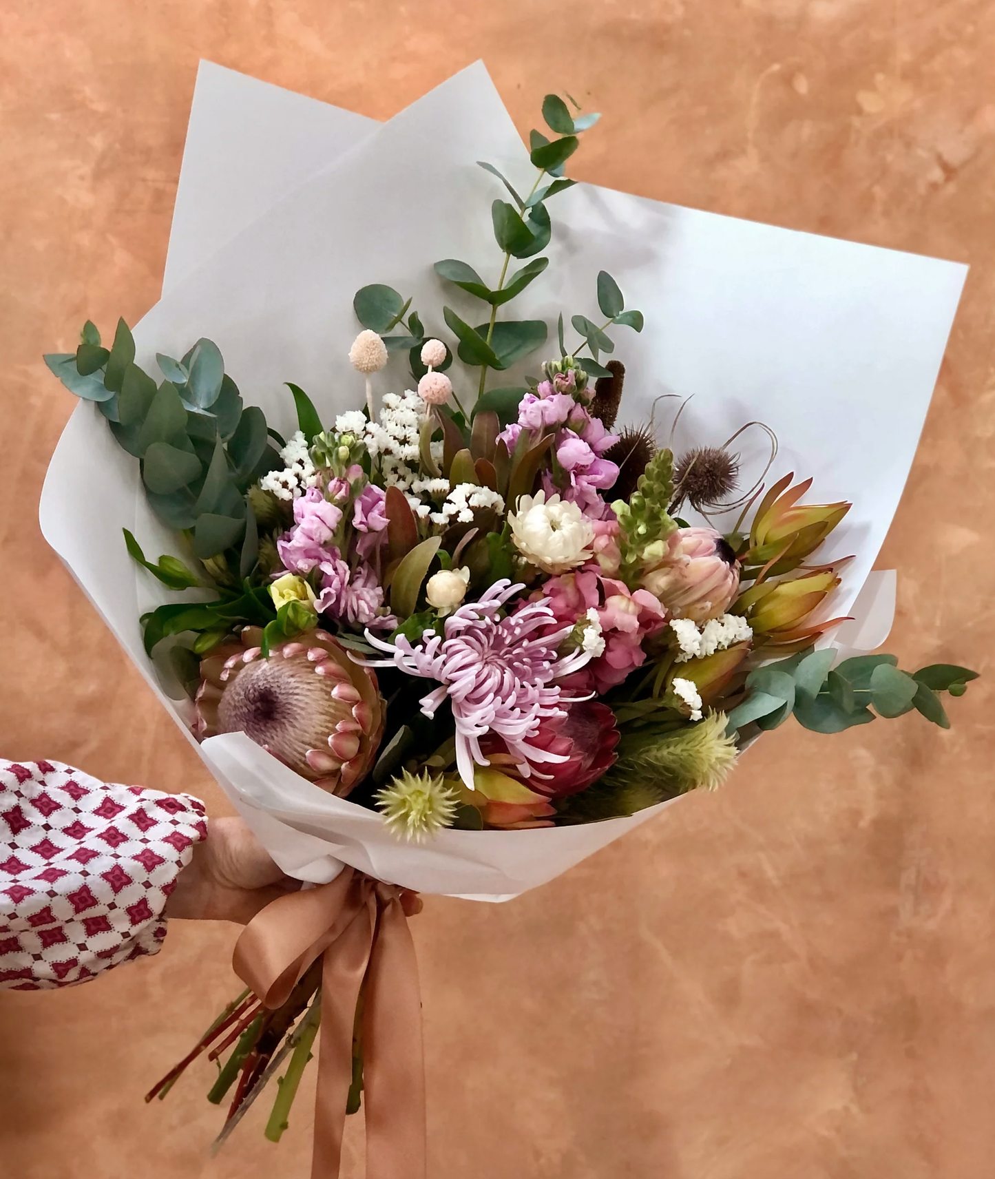 Photograph of a bouquet of colourful native and exotic flowers