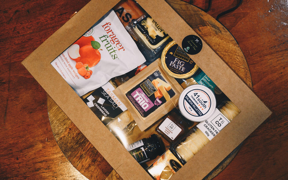Gift box containing delicious Tasmanian treats and condiments like Ashgrove cheese and salmon rillettes